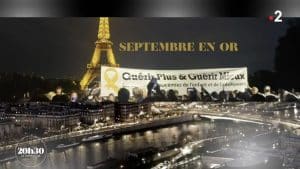 La Tour Eiffel sest illuminee dor pour soutenir la lutte contre les cancers pediatriques